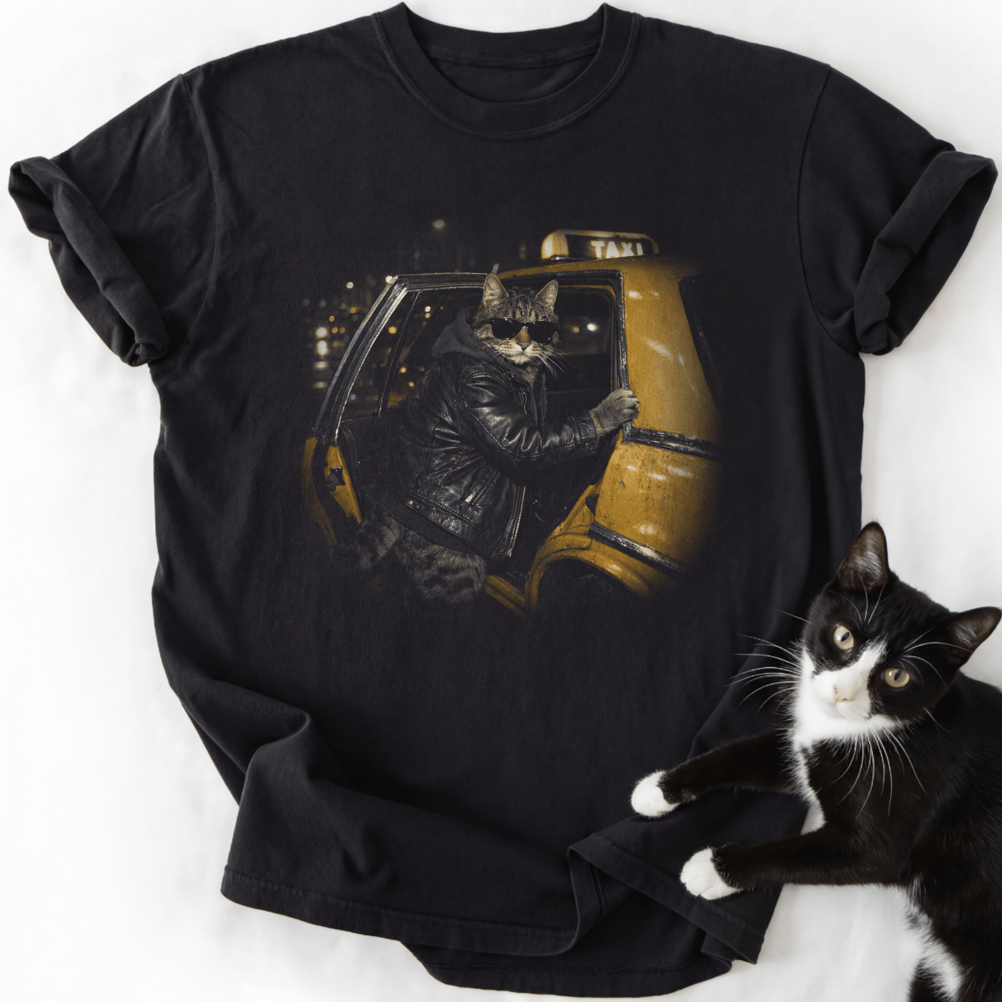 Midnight Taxi graphic tee with tabby cat in sunglasses and leather jacket on yellow taxi