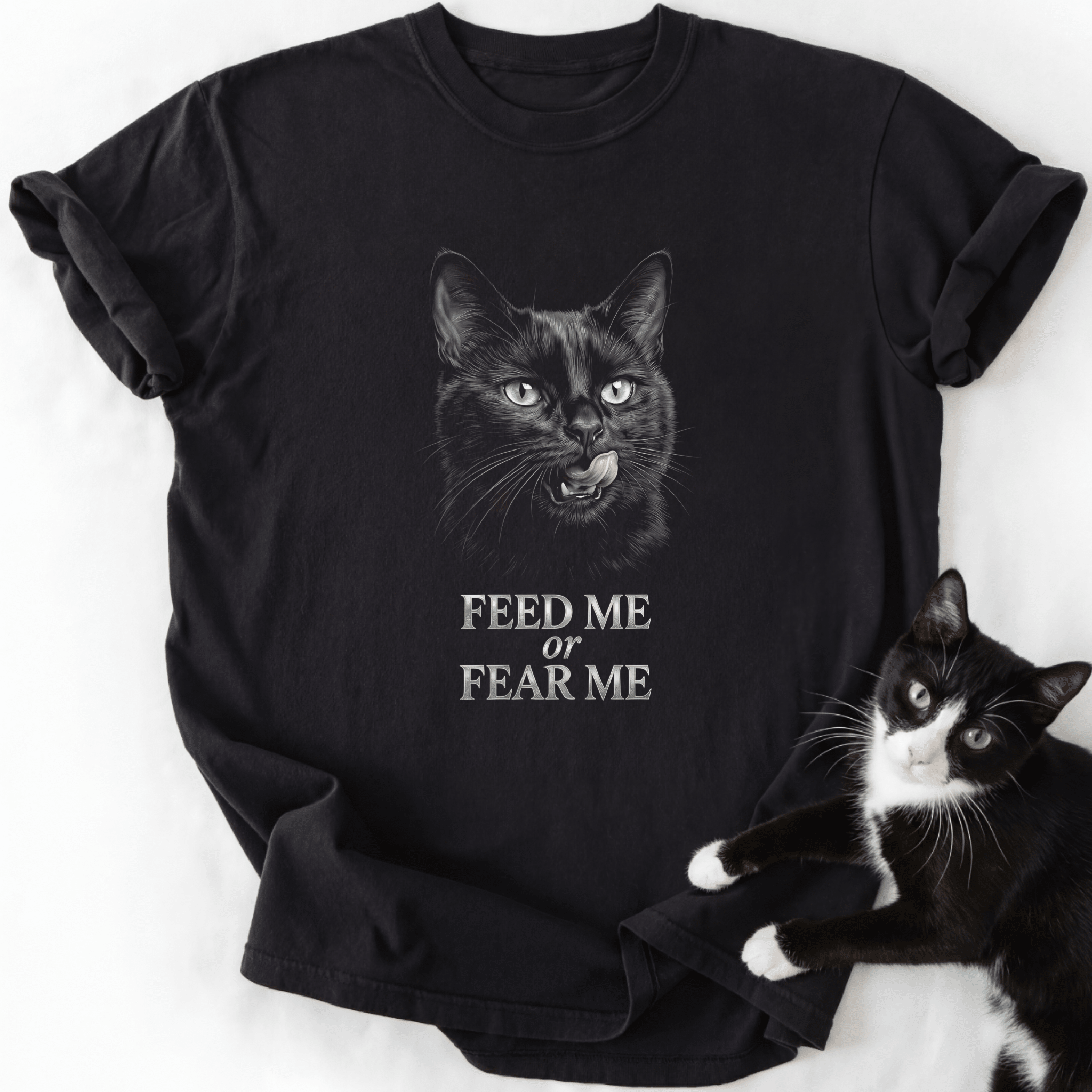 Black Feed or Fear Me cat graphic tee with grayscale cat illustration and text