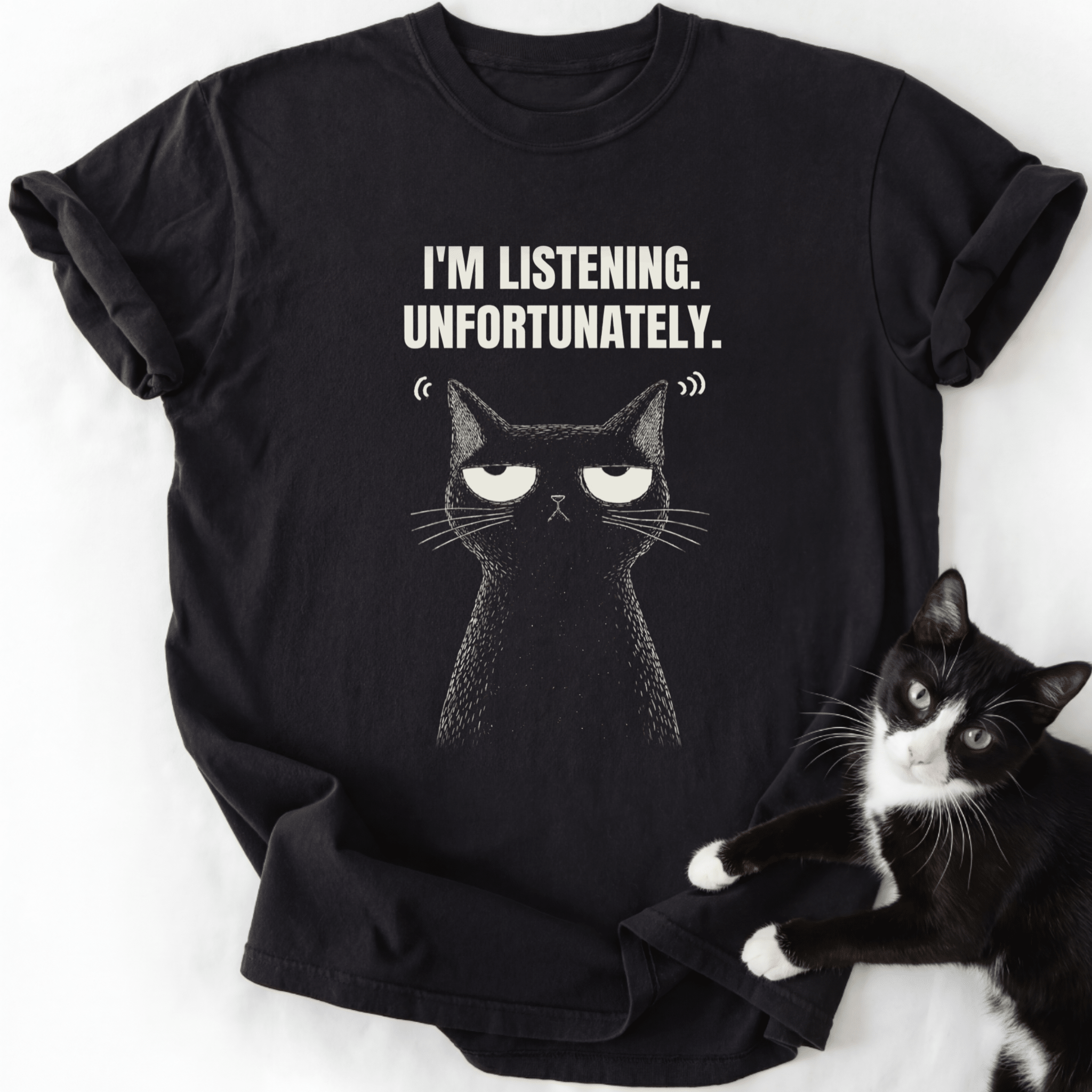Black I'm Listening Unfortunately cat graphic tee laid flat