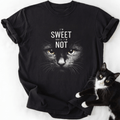 Black crew neck cat lover shirt with yellow-eyed feline graphic and humorous quote
