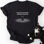 Black graphic tee with 'Stop Having Opinions Near Me' cat text and line art