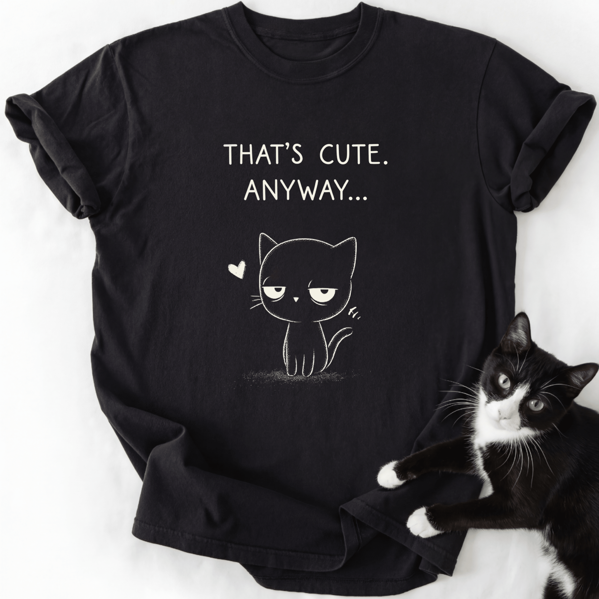 Black That's Cute Anyway cat graphic tee with white text and line art