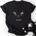 Black Try Meow cat graphic tee featuring white eyes design and relaxed fit