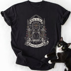 Black short-sleeve t-shirt featuring crowned cat design and 'Bow to the Purring Overlord' print