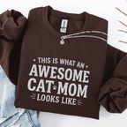 Dark Chocolate awesome cat mom embroidered sweatshirt with “This Is What An Awesome Cat Mom Looks Like” text, folded flat on light denim