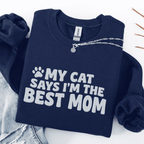 Navy cat mom embroidered sweatshirt with “My Cat Says I’m The Best Mom” text, folded flat on light denim