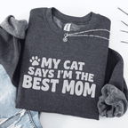 Dark Heather cat mom embroidered sweatshirt with “My Cat Says I’m The Best Mom” text, folded flat on light denim