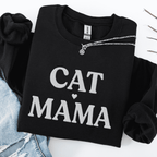 Black cat mama embroidered sweatshirt, folded flat on light denim