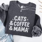 Dark Heather cats coffee mama embroidered sweatshirt with paw print detail, folded flat on light denim