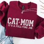 Maroon cat mom embroidered sweatshirt with “Cat Mom It’s A Full-Time Job” text, folded flat on light denim
