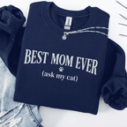 Navy cat mom embroidered sweatshirt with “Best Mom Ever (ask my cat)” text, folded flat on light denim