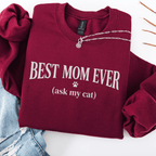 Maroon cat mom embroidered sweatshirt with “Best Mom Ever (ask my cat)” text, folded flat on light denim