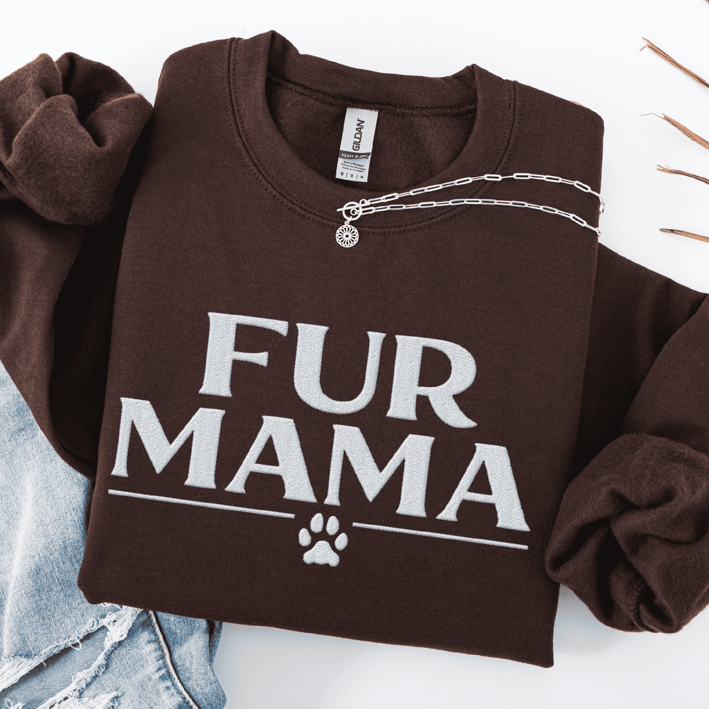 Dark Chocolate fur mama embroidered sweatshirt with paw print detail, folded flat on light denim