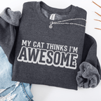 Dark Heather cat embroidered sweatshirt with “My Cat Thinks I’m Awesome” text, folded flat on light denim