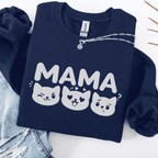 Navy mama embroidered sweatshirt with cat face design, folded flat on light denim