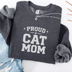 Dark Heather proud cat mom embroidered sweatshirt with “Proud Cat Mom” text, folded flat on light denim