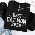 Black cat mom embroidered sweatshirt with “Best Cat Mom Ever” text, styled flat on light denim