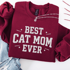 Maroon cat mom embroidered sweatshirt with “Best Cat Mom Ever” text, styled flat on light denim