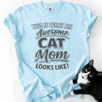 Chambray cat mom t-shirt with “This Is What an Awesome Cat Mom Looks Like” graphic shown in a flat lay with a black cat