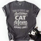 Pepper cat mom t shirt with “This Is What an Awesome Cat Mom Looks Like” design and black and white cat beside the shirt