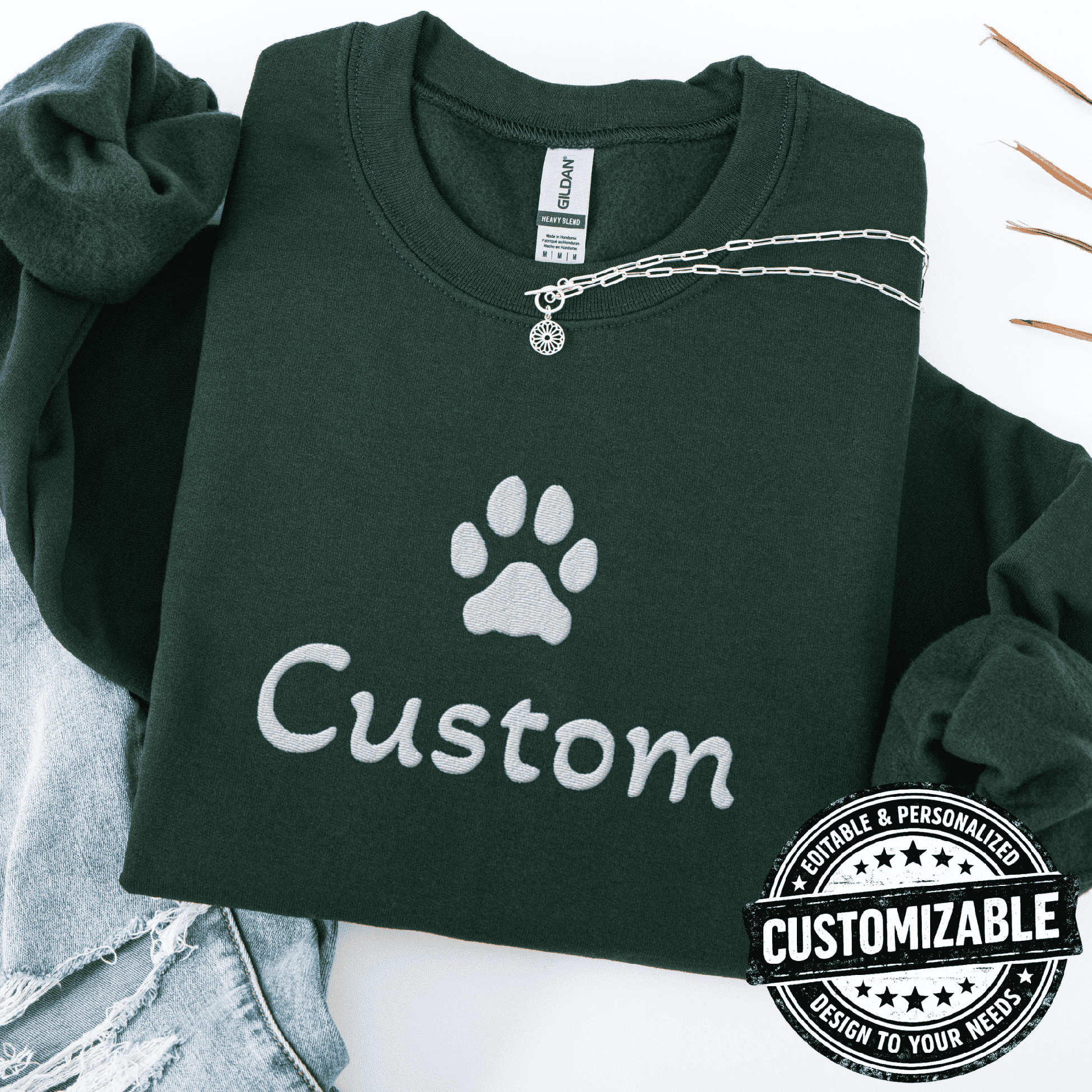 Forest green cat embroidered sweatshirt with white paw print and customizable text on the front
