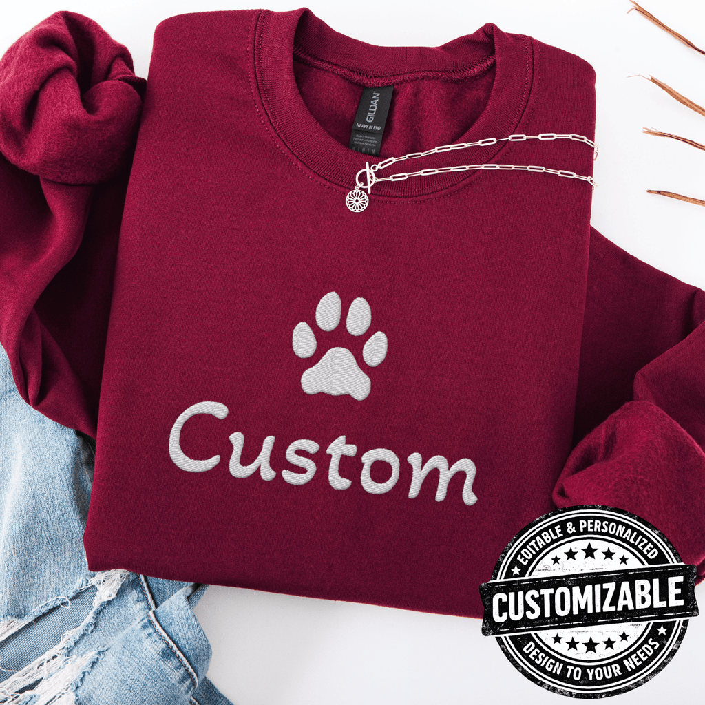 Maroon cat embroidered sweatshirt with white paw print and customizable text