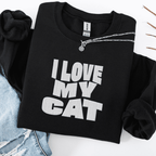 Black embroidered cat sweatshirt with the phrase “I Love My Cat” shown folded flat