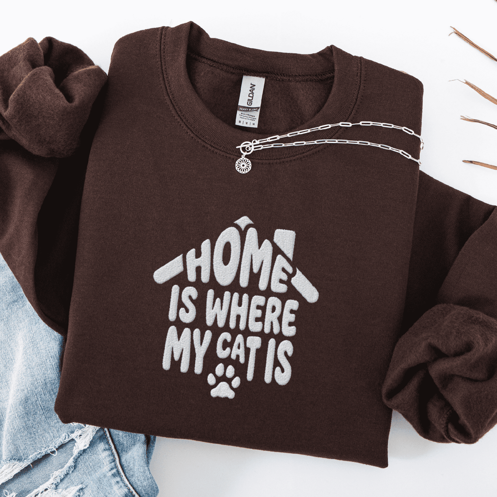 Dark Chocolate embroidered cat sweatshirt with the phrase “Home Is Where My Cats Are” shown folded flat