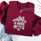 Maroon embroidered cat sweatshirt with the phrase “Home Is Where My Cats Are” shown folded flat