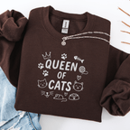 Dark Chocolate embroidered cat sweatshirt with “Queen of Cats” text and cat-themed doodle icons shown folded flat