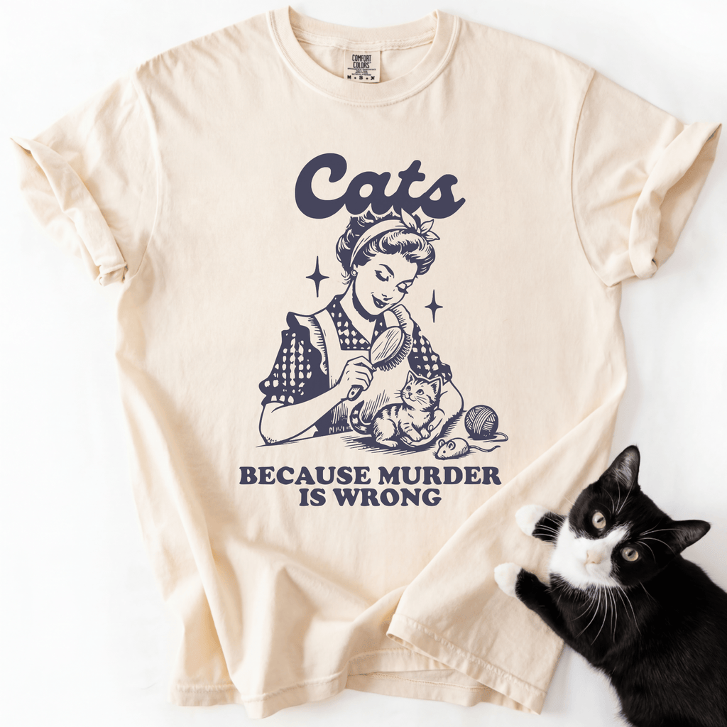 Cream cat t shirt with vintage black cat illustration and the phrase “Cats Because Murder Is Wrong”