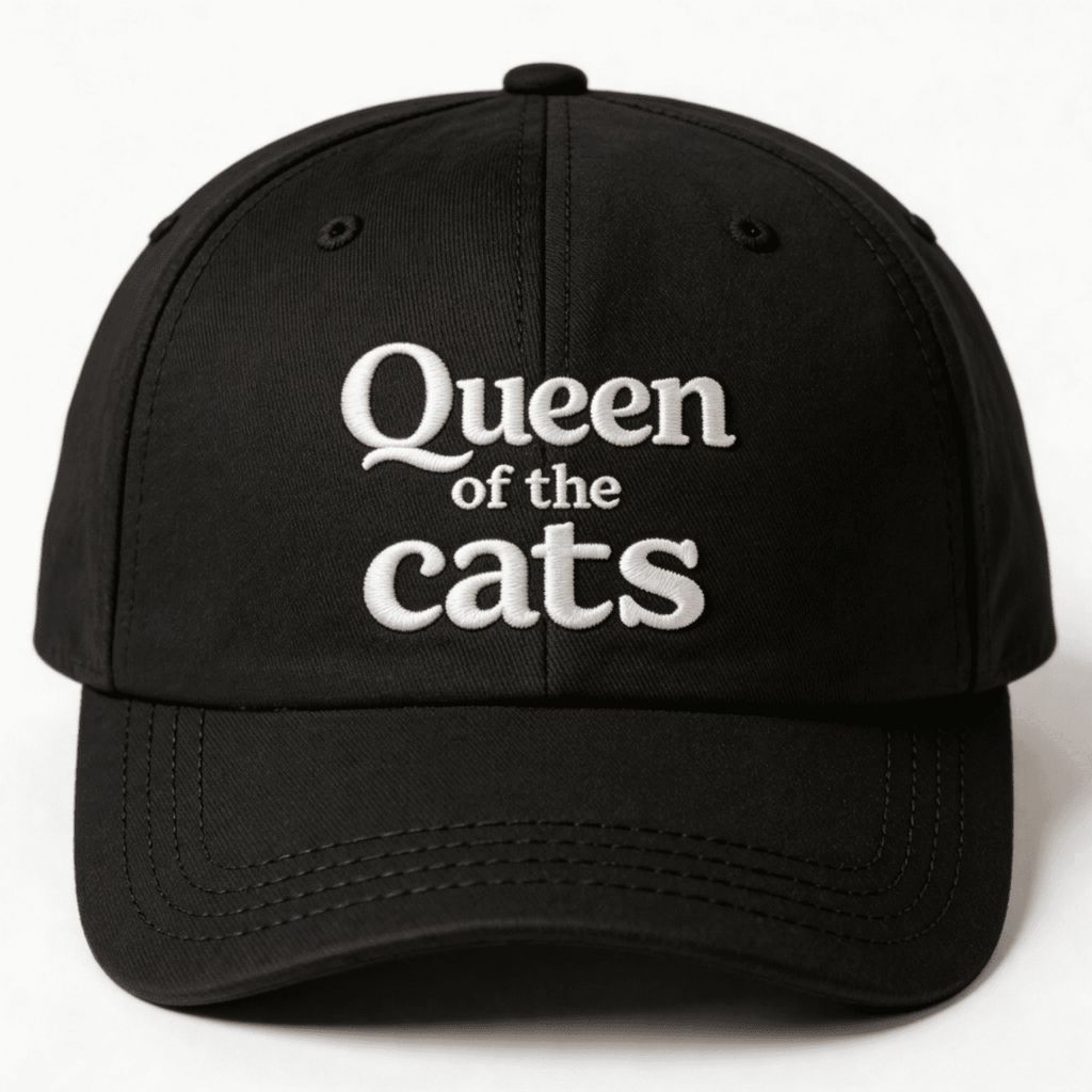Black cap with white Queen of the Cats embroidery shown from the front