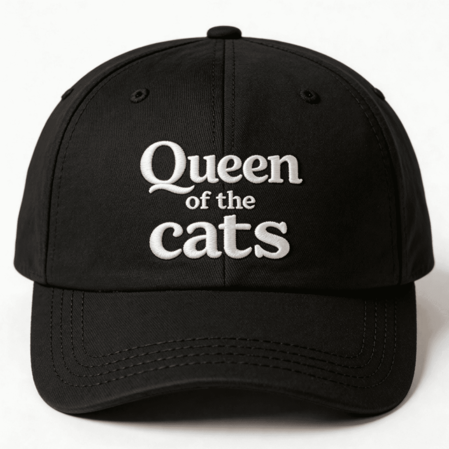 Black cap with white Queen of the Cats embroidery shown from the front