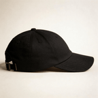 Side view of a black embroidered cap with curved brim