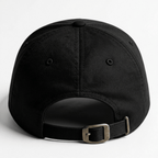 Back view of black adjustable cap with metal buckle closure