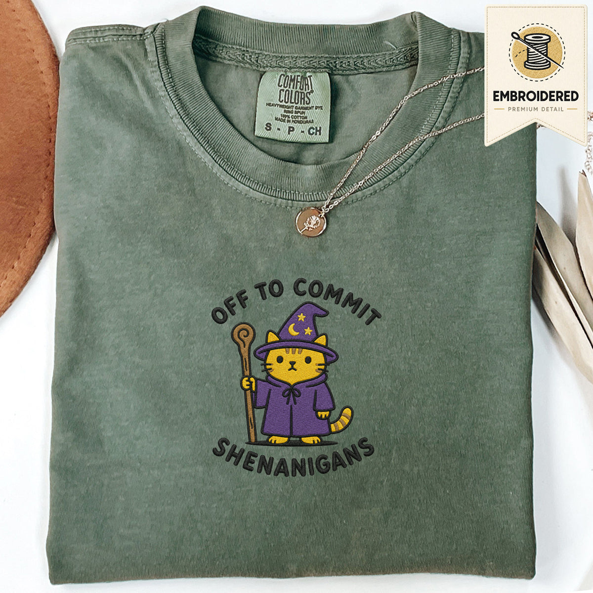 Moss green embroidered funny cat t shirt with Commit Shenanigans cat graphic