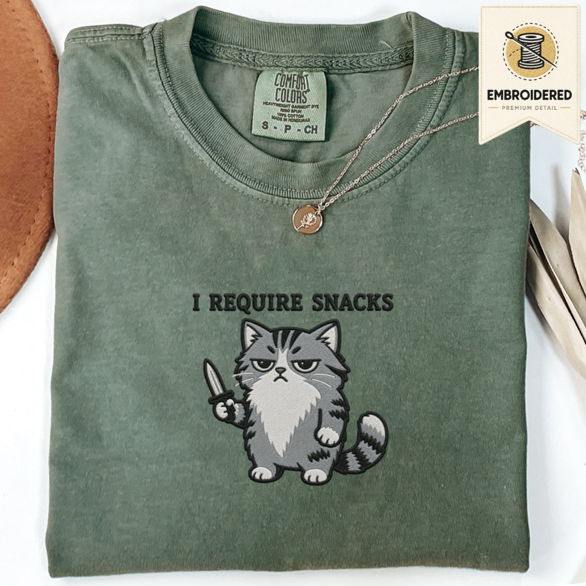 Moss green embroidered funny cat t shirt with Require Snacks cat graphic