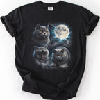 Black graphic cat t shirt with moonlit British Shorthair cat artwork and glowing full moon, folded flat