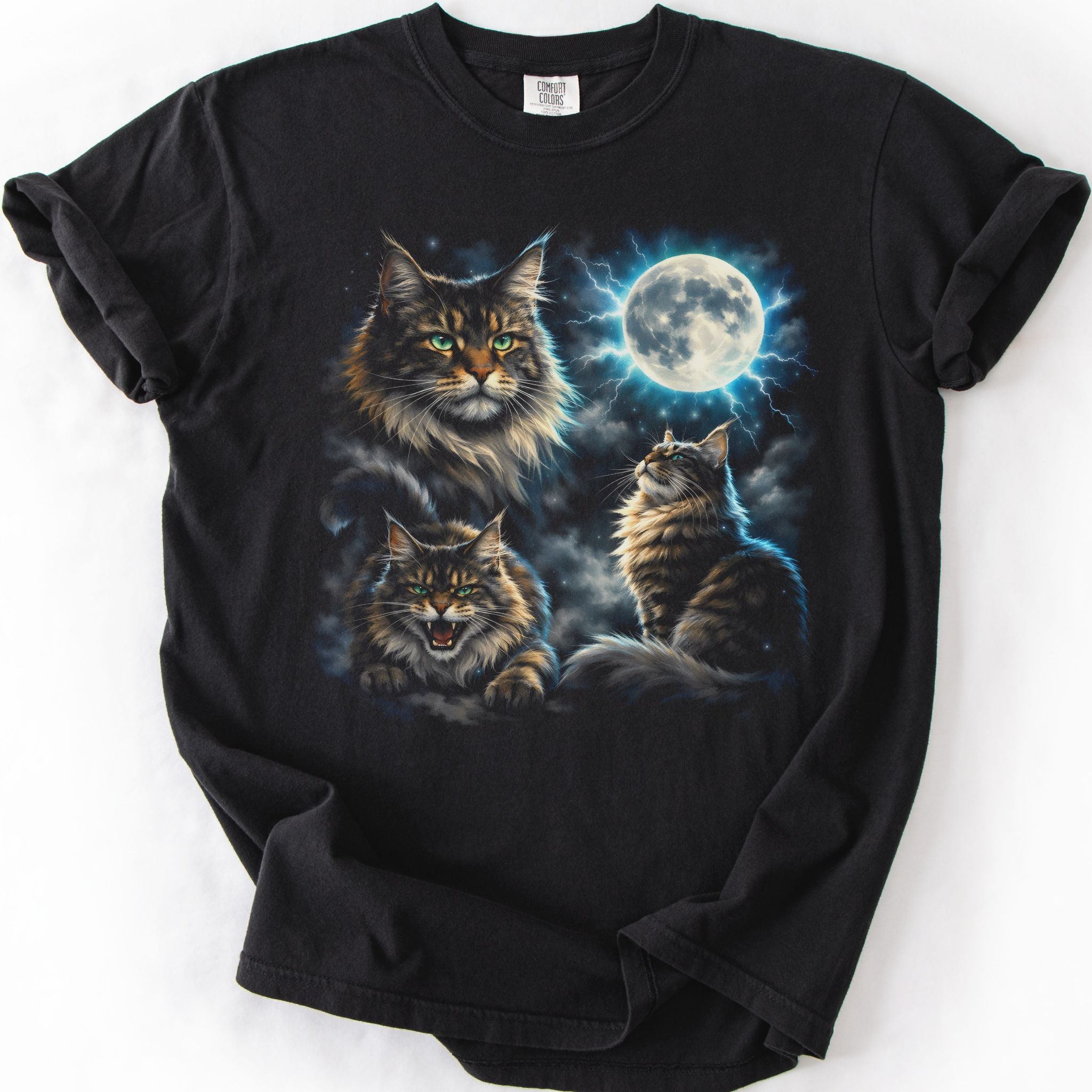 Black graphic cat t shirt with moonlit Maine Coon cat artwork and glowing full moon, folded flat