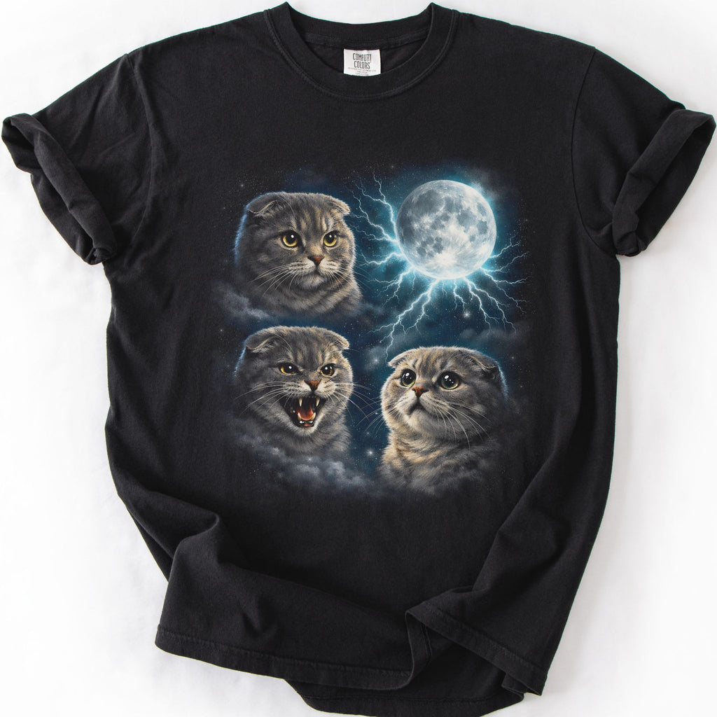 Black graphic cat t shirt with moonlit Scottish Fold cat artwork and glowing full moon, folded flat