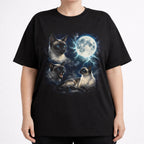 Front view of black cat t shirt on a model with detailed Siamese cat and moon graphic