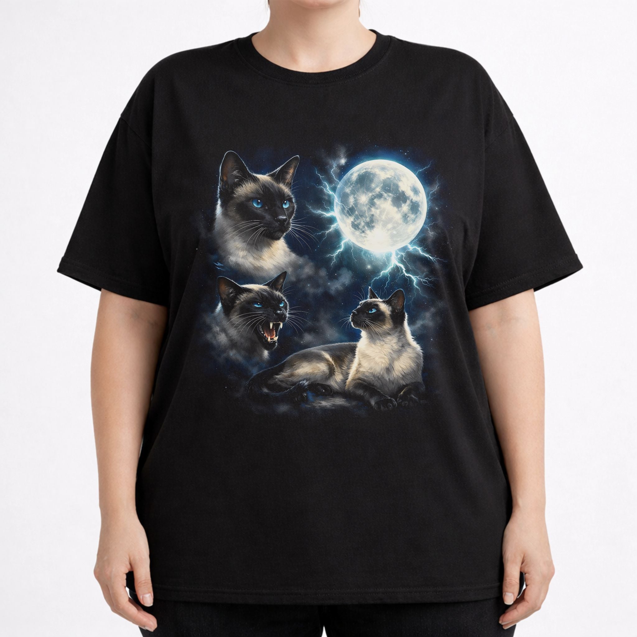 Front view of black cat t shirt on a model with detailed Siamese cat and moon graphic