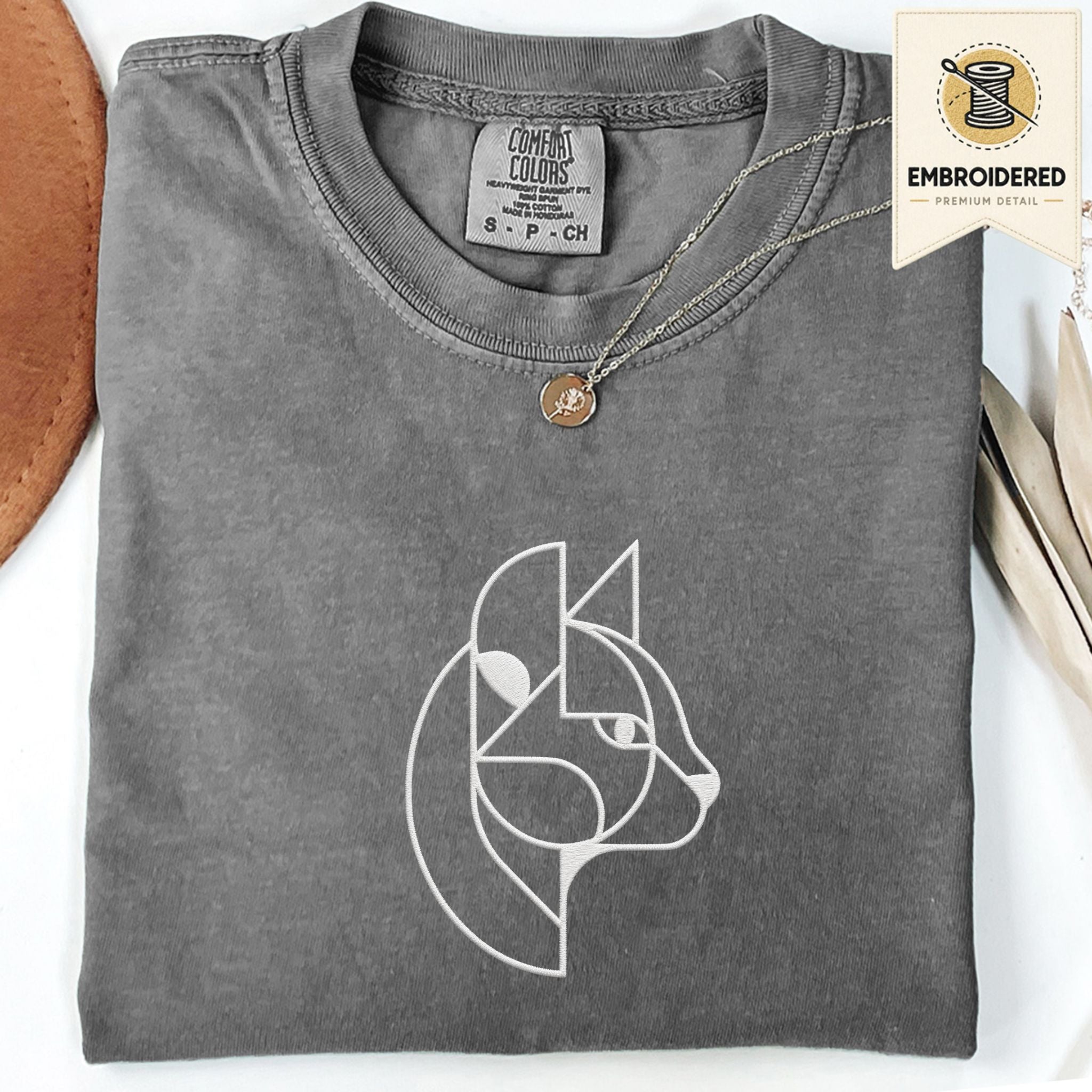 Pepper Comfort Colors 1717 t shirt with abstract cat embroidery style line art design, folded flat