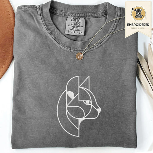 Pepper Comfort Colors 1717 t shirt with abstract cat embroidery style line art design, folded flat