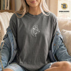 Model wearing a Pepper Comfort Colors 1717 abstract cat embroidered t shirt