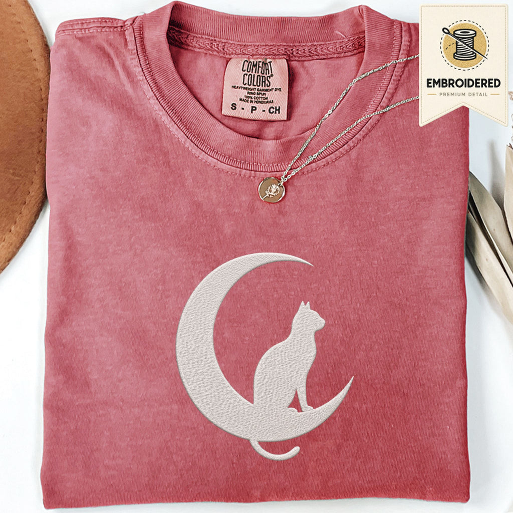 Crimson Comfort Colors 1717 t shirt with crescent moon and sitting cat embroidered style design, folded flat