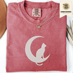 Crimson Comfort Colors 1717 t shirt with crescent moon and sitting cat embroidered style design, folded flat