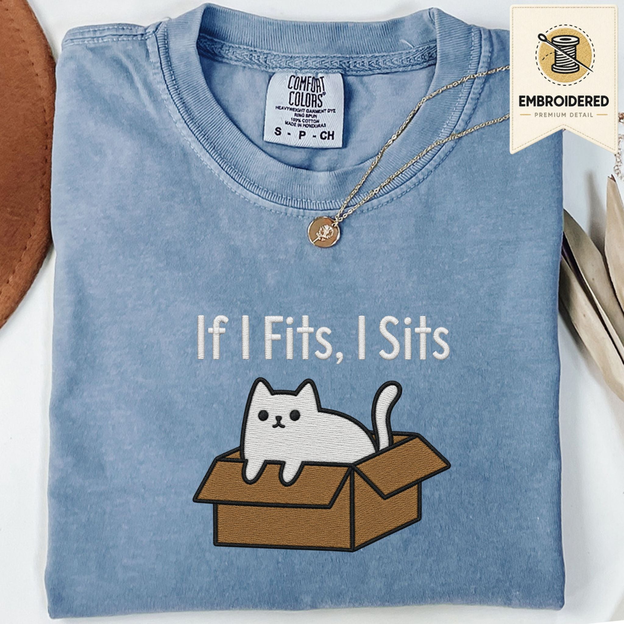 Blue Jean Comfort Colors 1717 t shirt with If I Fits, I Sits cat in box embroidered style design, folded flat