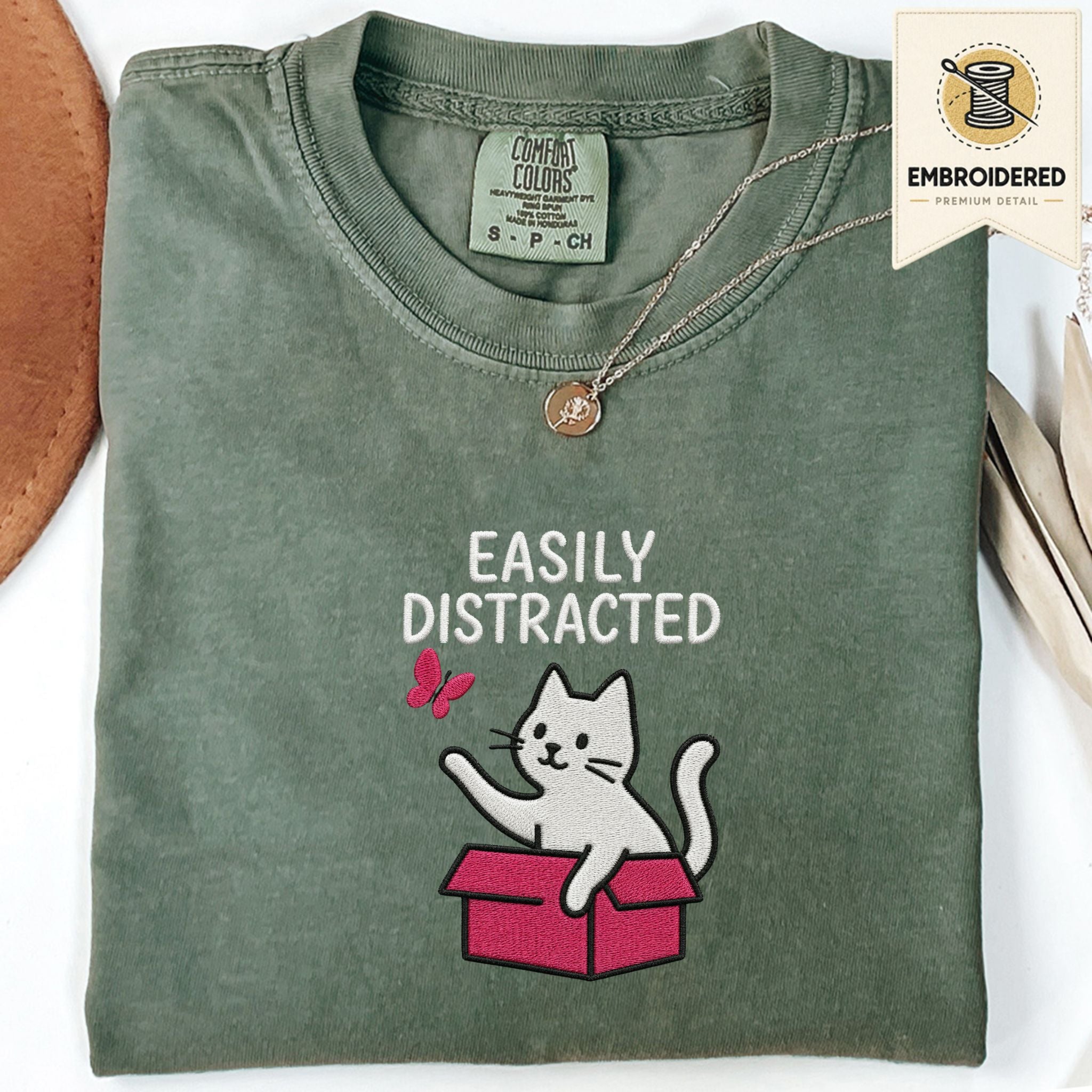 Moss Comfort Colors 1717 t shirt with Easily Distracted text and cat in box embroidered style design, folded flat