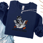 Navy embroidered cat sweatshirt with cool grey cat in sunglasses riding a goose, Born to Honk text, flat lay